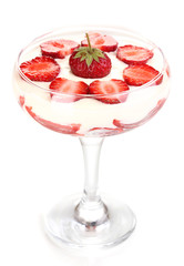 Glass of ripe strawberries with cream isolated on white