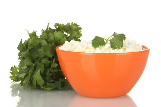 cottage cheese with parsley in orange bowl isolated on white