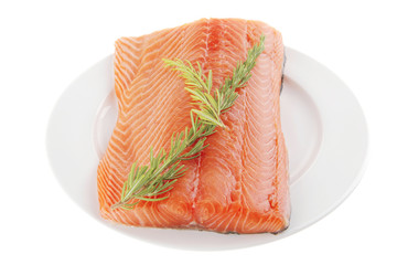 raw salmon fillet on white and rosemary