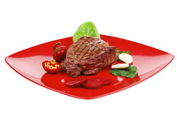 barbecued meat : beef ( lamb ) garnished on red plate