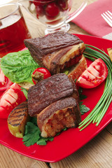 beef fillet mignon grilled and garnished with vegetables