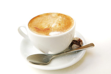 small white cup of cappuccino