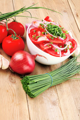 fresh tomato salad in white bowl