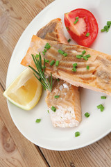 salmon steaks on white dish