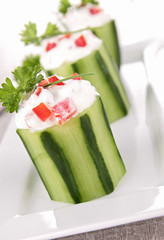 cucumber garnish with cream and pepper