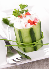 cucumber garnish with cream and pepper