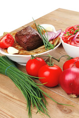 food : roasted fillet mignon on bread with tomatoes salad