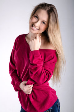Smiling girl in red pullover