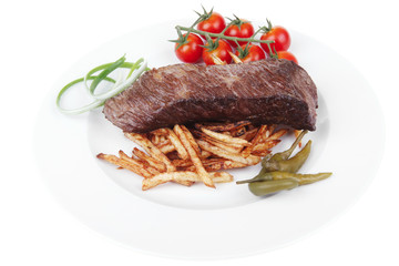 meat on potato chips with fresh tomato