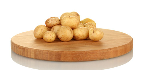 young potatoes on a cutting board isolated on white background