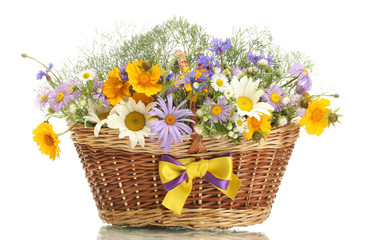 beautiful bouquet of bright  wildflowers in basket, isolated
