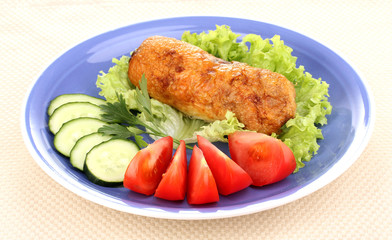 Tasty meat cutlet with garnish on plate