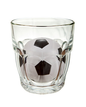 Soccer ball in glass over white background