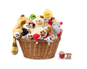 Stuffed animal toys in a basket .isolated on a white background