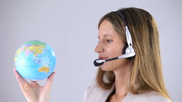 woman beautiful smiling office operator whit globe