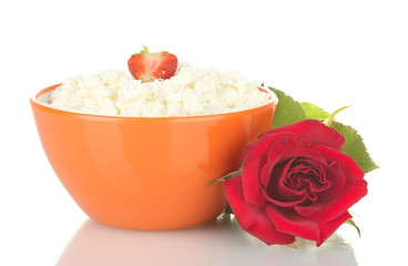 cottage cheese with strawberry in orange bowl and flower