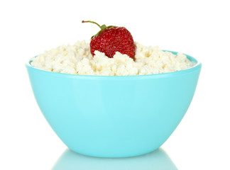 cottage cheese with strawberry in blue bowl isolated on white
