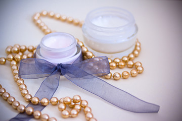 luxury spa products and gold necklace, with vignette