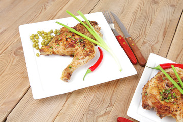 legs garnished with green peas