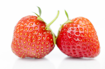 Two strawberryes isolated on white