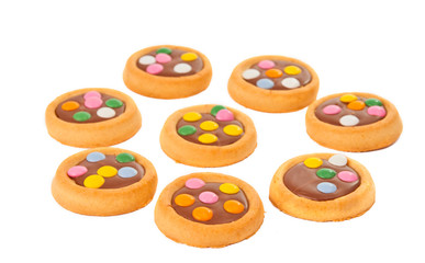 Biscuits with milk chocolate and coloured chocolate beans isolat