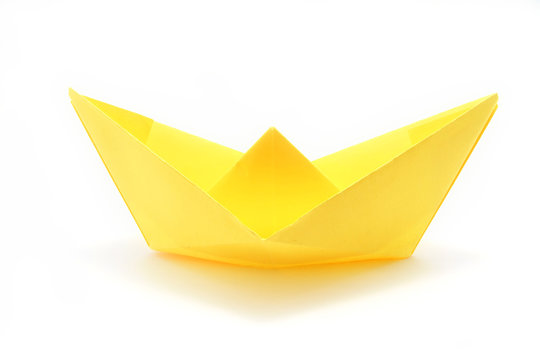 Single Yellow Paper Boat Over White