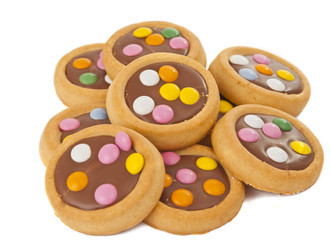 Biscuits with milk chocolate and coloured chocolate beans isolat