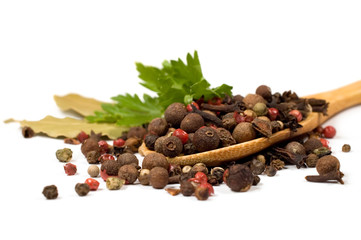 spices and parsley in a wooden spoon