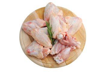 chicken wings on a wooden cutting board isolated on white