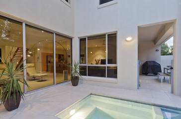 Fototapeta na wymiar Modern house with living room and backyard