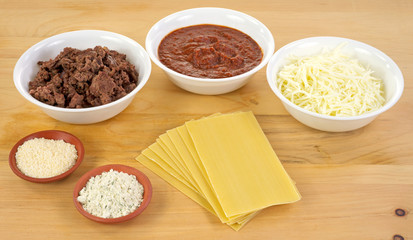 Lasagna ingredients on wood cutting board
