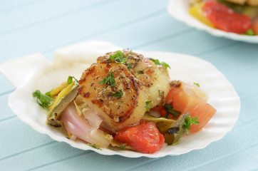 Seared scallops on marinated vegetables