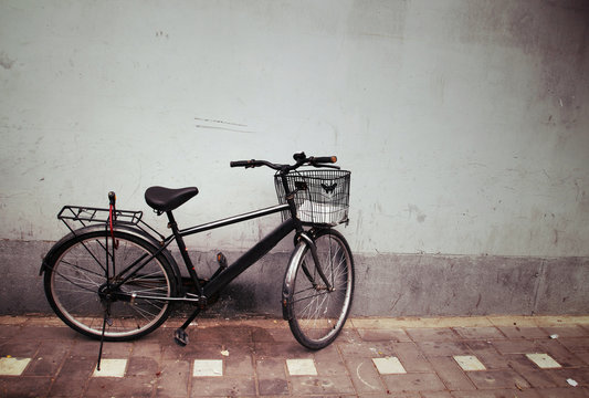 Old Bicycle against a Wall