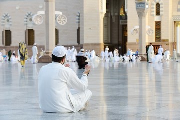 Muslim prayer at holy mosque