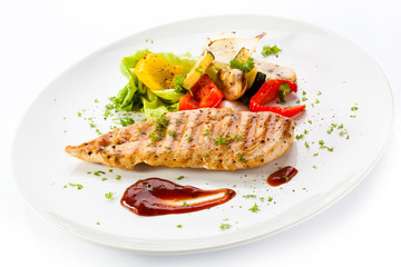 Grilled chicken breasts and vegetables