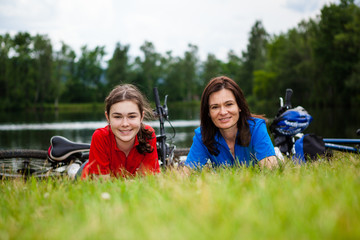 Girls resting after bicycle ride 