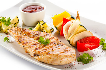 Grilled chicken breasts and vegetables