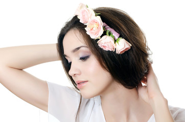 Portrait of the beautiful girl with flowers in hair