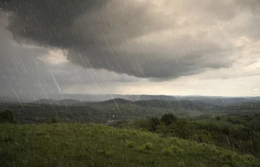 Fotobehang Beige landschap met regen en dramatische wolken over heuvels  © andreiuc88