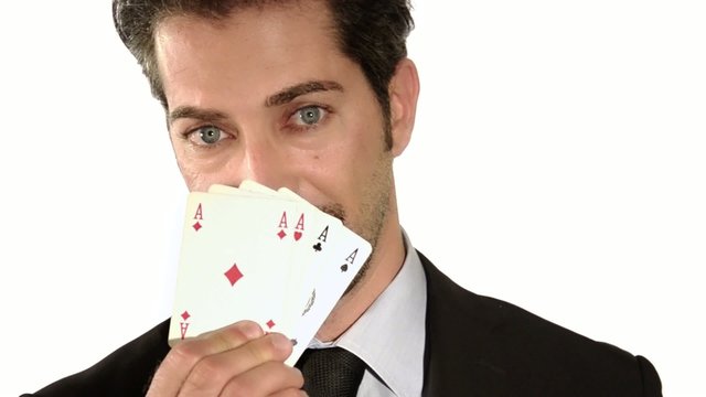 businessman holding aces poker cards