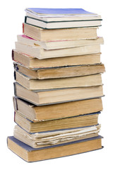 The tower of the old retro shabby torn unwanted books isolated