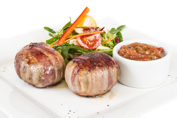 Grilled steak wrapped in bacon, with grilled vegetables, mashed