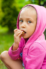 Little girl eating chocolate cake