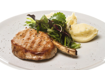 Grilled pork with salad and potato