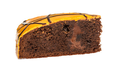 Piece of chocolate cake with icing on white isolated background
