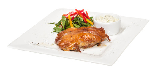 roasted chicken with vegetables on a white plate
