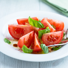 Tomato salad with basil, olive oil and balsamic vinegar