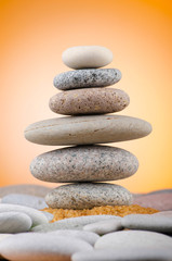 Balanced pebbles with colour background