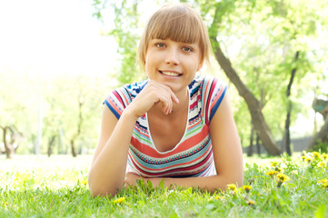 portrait of a beautiful woman in summer park