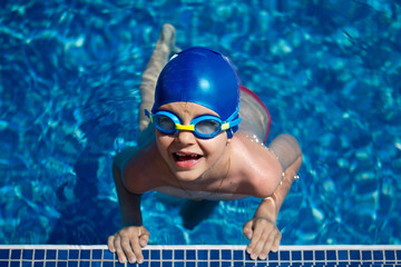 Happy child in a swimming pool